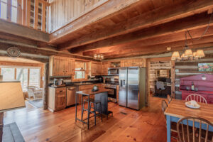 1303 homestead,Stonebridge cabins for sale, Todd NC log homes, antique log cabins in North Carolina, log homes for sale Todd NC, High Country real estate, homes for sale in Todd NC, Blue Ridge Mountain homes, log cabins near Boone NC, rustic log homes North Carolina, cabins with mountain views for sale, 3 bedroom log home in Todd NC, mountain view homes in Ashe County, authentic log cabin for sale Stonebridge NC, homes near New River Todd NC, real estate in Stonebridge Todd NC, Appalachian style log homes for sale, log cabin with Tesla charger NC, North Carolina mountain homes with land, homes for sale near Boone and West Jefferson, rustic homes in the NC High Country, mountain retreat North Carolina, homes with cathedral ceilings and fireplaces, sunroom with Blue Ridge views, homes with workshop and storage, fenced yard mountain cabin, homes with granite countertops and gas stoves, energy-efficient mountain homes NC, outdoor living homes in the Blue Ridge, pet-friendly mountain cabins, homes with private decks and views